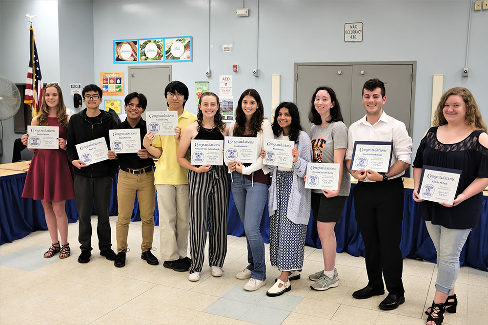 The School board honored Highland High School’s Top 10 students in the Class of 2022: [L-R] Evelyn Wright going to SUNY New Paltz; Ryan Ta to Binghamton University; Marcelo Cuya to Stevens Institute of Technology; Tyreese Ling to Colby College; Margaret Van Valkenburgh to Hartwick College; Ava DeMassio to the International Medical Aid Internship program in Mombasa, Kenya in the fall and in the HQ Internship program in Athens, Greece in the spring; Riya Shenoy to University of Southern California; Dorthy Suzucki-Burke to Rochester Institute of Technology; Salutatorian Dimitrios Bakatsias to SUNY Stony Brook and Valedictorian Katelin McPeck to Rensselaer Polytechnic Institute.